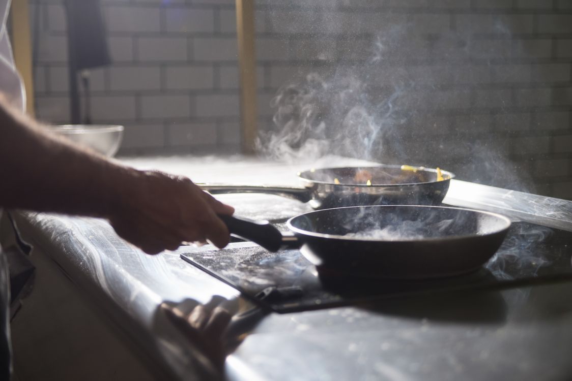 Best frying pan for electric stove — chef cooking with nonstick pans on electric stove