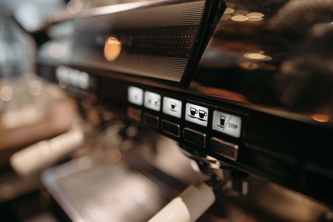 Close-up of an espresso machine control panel and portafilter — semi-automatic espresso machine guide