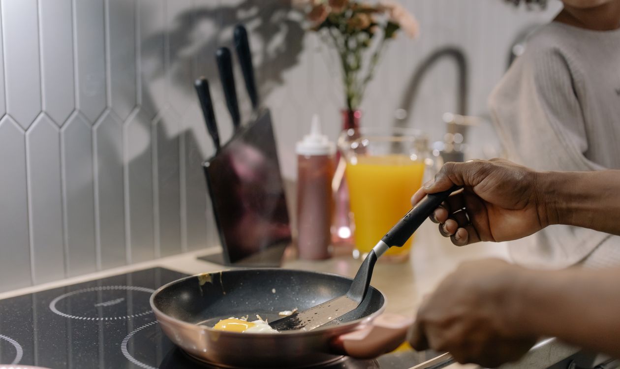 Cooking eggs in a nonstick frying pan on an induction stovetop