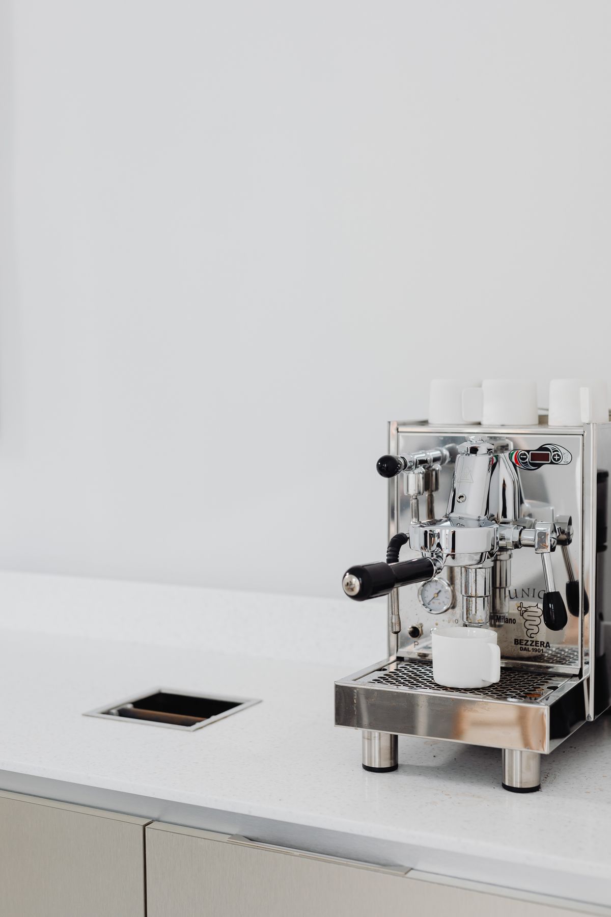 Stainless steel espresso machine on a kitchen counter