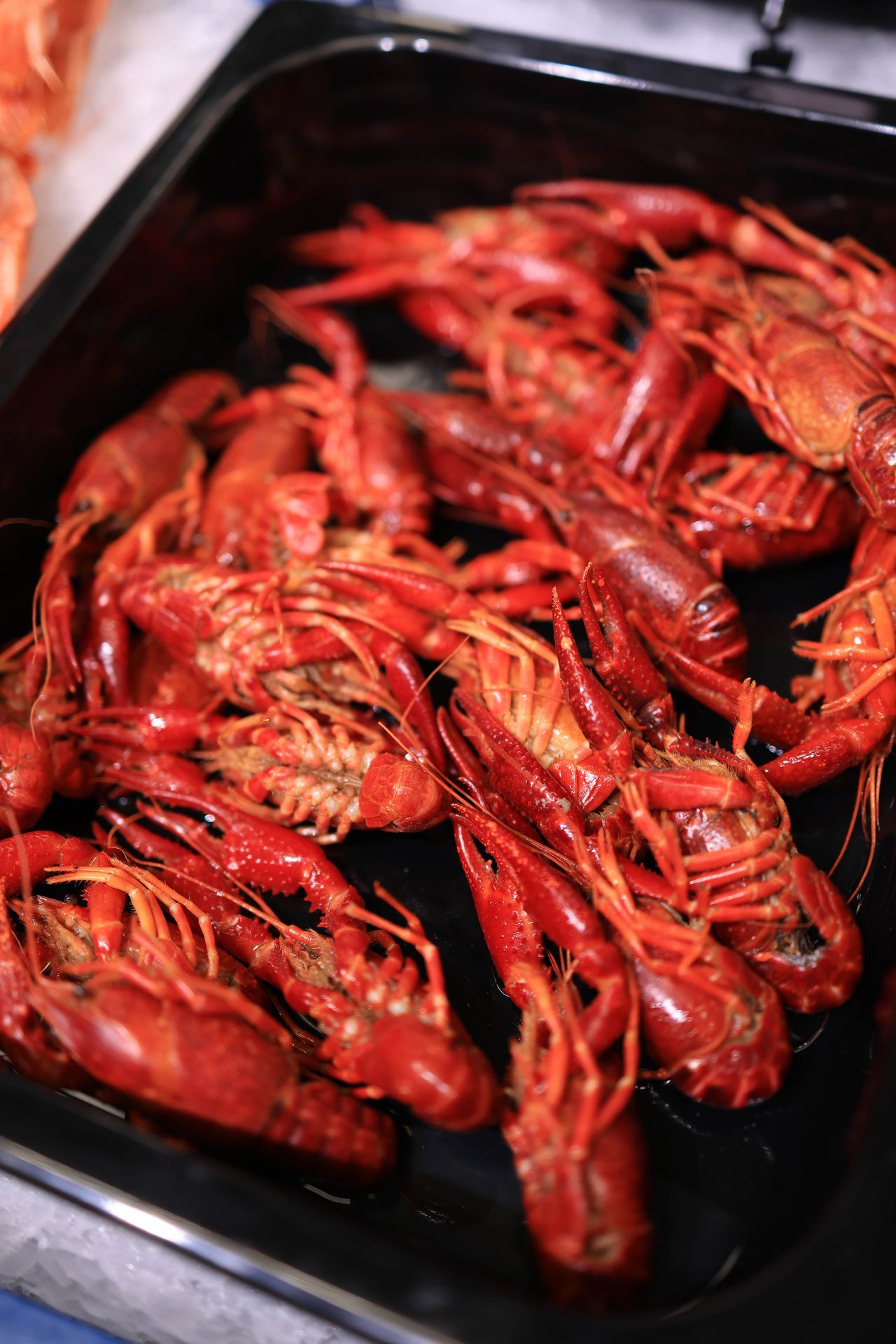 A heaping tray of boiled crawfish ready to eat